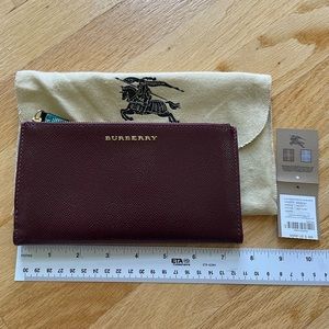 Burberry Patent leather continental wallet